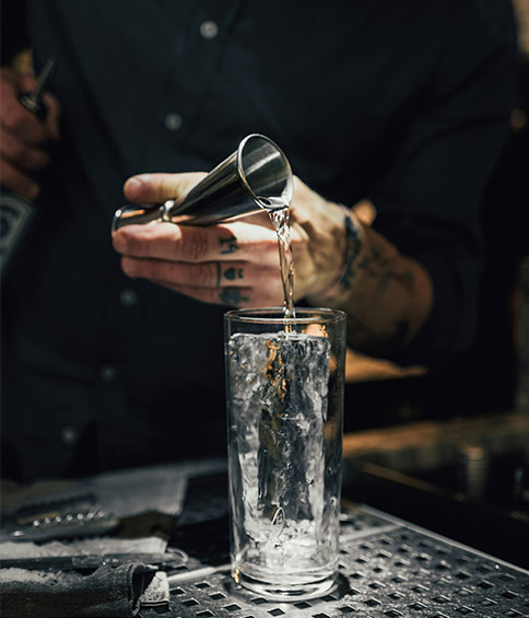 bartender serving a glass